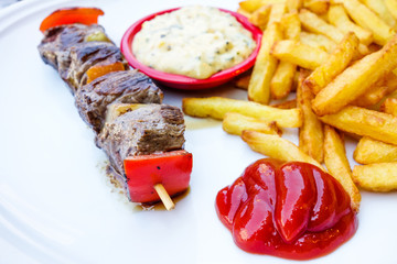 tasty grilled meat and vegetables skewers