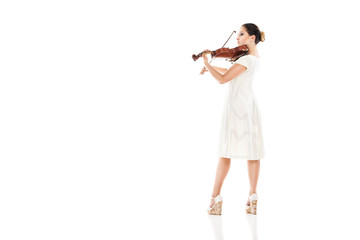 Beautiful young woman playing violin over white