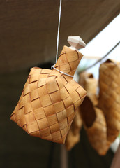 bottle made of birch bark hanging by a thread
