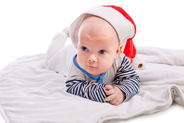 Cute baby boy in Santa`s hat