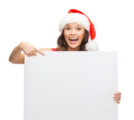 woman in santa helper hat with blank white board