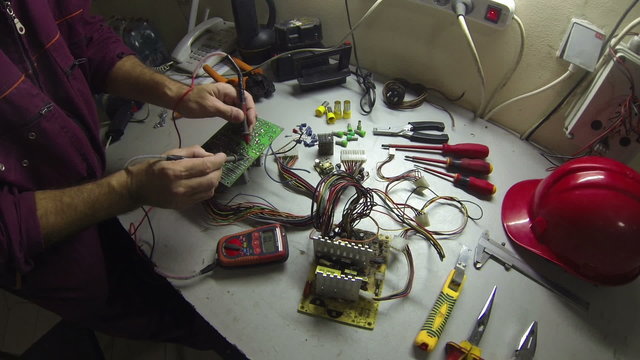 Electrician Working With Digital Multimeter .