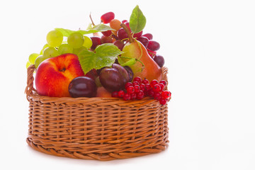 Fresh fruit basket isolated on white background. 