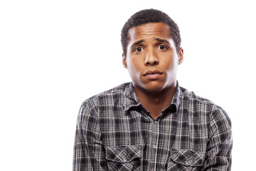 african man posing with a sad expression on white background