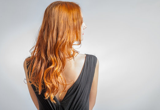 Back View Of Red Curly Long Hair Beautiful Woman