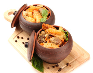 Homemade beef stir fry with vegetables in pots isolated on