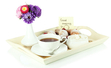 Cup of tea with cakes on wooden tray isolated on white