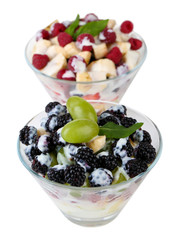 Fruit salad in glass bowls, isolated on white