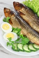 Smoked fish on plate close up