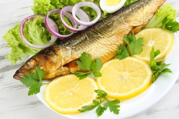 Smoked fish on plate close up