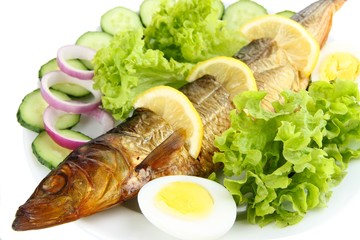 Smoked fish on plate close up