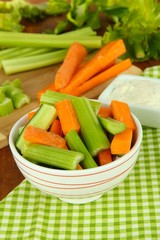 Fresh green celery with vegetables in bowl on table close-up