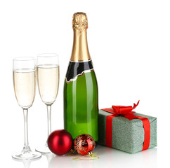 Bottle of champagne with glasses and Christmas balls isolated