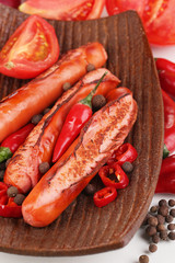 Delicious sausages on plate close-up