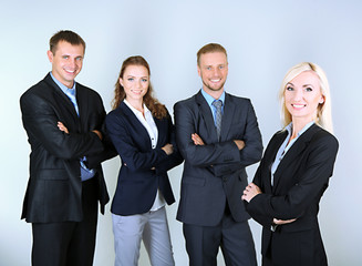 Group of business people on gray background