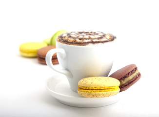 A cup of cappuccino with cookies
