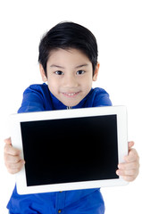 Little asian boy smiles with tablet computer on isolated backgro