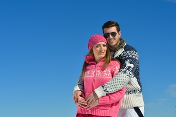 Young Couple In Winter  Snow Scene