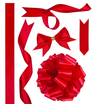 Collage of red ribbons and bows on white