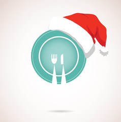 christmas dinner. plate wearing christmas red hat