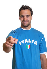 Sports fan from Italy pointing at camera