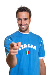 Laughing fan from Italy pointing at camera