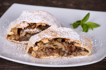 Slice of an apple strudel on a plate