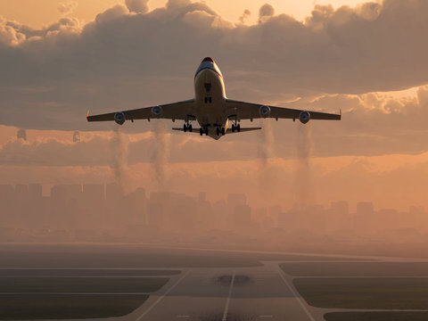 airplane taking off at sunrise