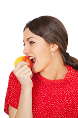 Pretty young woman eating apple
