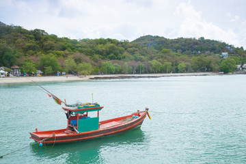 Fototapeta na wymiar Small fishing boats moored in the sea.