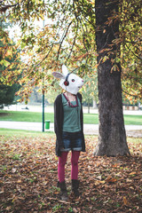 rabbit mask woman listening to music