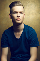 Portrait of a young man with very handsome face in blue t-shirt