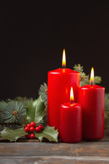 Christmas candles with evergreen decorations