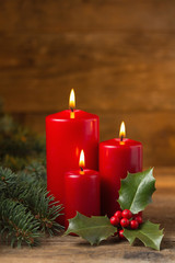 Christmas candles with evergreen decorations