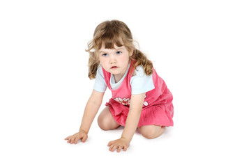 Little pretty girl crawls on floor isolated on white background.