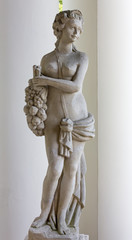 Statue of a Young Girl Carrying Fruits
