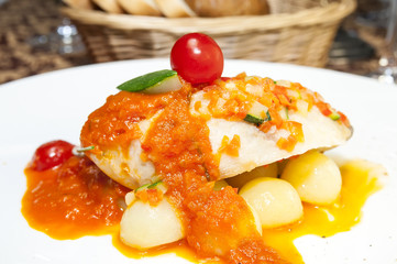 baked fish with potatoes in tomato sauce