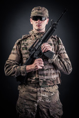 Fototapeta premium Modern soldier with rifle