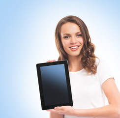 A girl holding a tablet computer over blue background