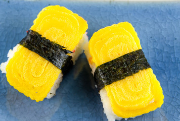 Tamago yaki is sushi using an egg , japanese food