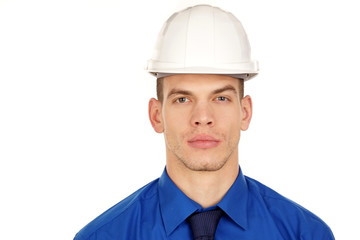 Portrait of a young businessman at blue shirt in a helmet.
