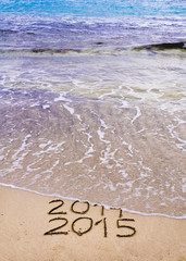 New Year 2015 is coming concept , the wave is covering 2014
