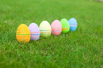 Colored colorful easter eggs in the grass