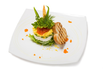 Salad of boiled shrimp under a dome of red caviar