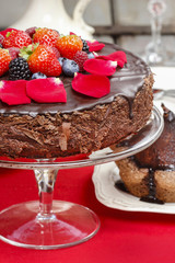 Chocolate cake with strawberries. Birthday party table