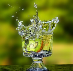 A splashing Kiwi fruit slice.
