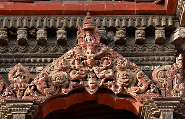 Fototapeta premium Carved wooden details on a Nepalese temple door