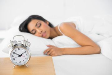 Calm beautiful woman sleeping lying in her bed
