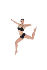 Fototapeta na wymiar Sporty young woman jumping isolated on white background