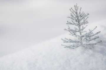 Silver Christmas decoration on snow
